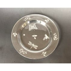 a glass plate with butterflies on it