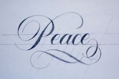 the word peace is written in cursive writing