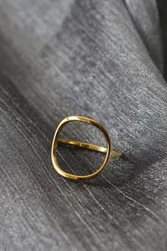 Make a simple statement with our Open Circle Ring. Crafted from stainless steel, this minimalistic ring adds a touch of geometric flair to any outfit. Perfect for those who appreciate understated style. Tarnish Proof Comes in a suede cinched pouch Modern Metal Midi Rings For Formal Occasions, Modern Metal Midi Rings, Minimalist Metal Midi Rings, Minimalist Metal Rings With Simple Design, Elegant Open Circle Midi Rings, Elegant Everyday Midi Rings, Chic Everyday Metal Rings, Minimalist Stainless Steel Midi Rings For Everyday, Minimalist Stainless Steel Midi Rings