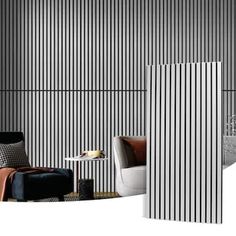 a room with black and white stripes on the wall next to a chair, table and ottoman