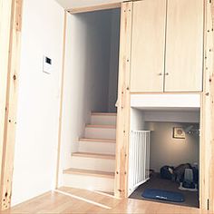 an unfinished room with stairs leading up to the second floor and closets on either side