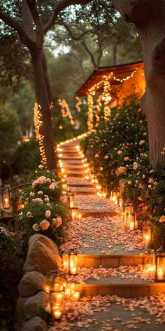 candles are lit on the steps leading to a house