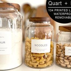 three glass jars filled with pasta and nuts