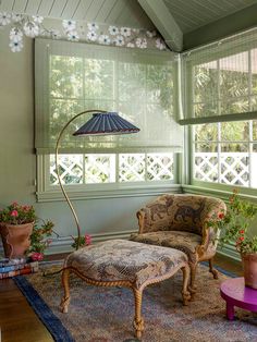 a living room filled with furniture and flowers