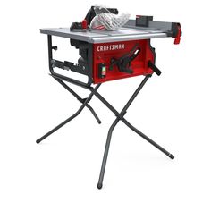 a portable table sawing machine sitting on top of a stand