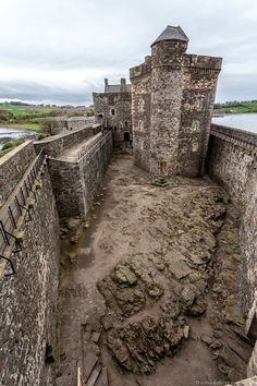 an aerial view of a castle with stairs leading up to it