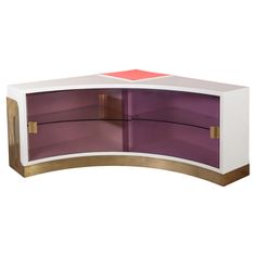 a white and purple cabinet with gold trim