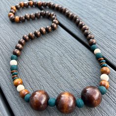 Embrace the beauty of nature with this handcrafted wooden bead necklace, perfect for those who love earthy, bohemian-inspired jewelry.  Made from high-quality, eco-friendly wood, this necklace offers a simple yet stylish look that complements any outfit.  Its natural tones and organic texture make it an ideal accessory for casual, everyday wear or as a statement piece for special occasions. FEATURES: - 28' Long and easily fits over head - Handcrafted with natural, sustainably sourced wooden bead Earthy Bohemian, Hawaiian Necklace, Wooden Bead Necklace, Beach Wedding Jewelry, Wooden Bead Necklaces, Wood Bead Necklace, Castle Rock, Jewelry Statement, Inspired Jewelry