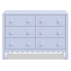 an image of a blue dresser with white dots on the top and bottom drawer drawers