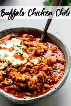 a bowl of buffalo chicken chili with sour cream on top and the words buffalo chicken chili above it