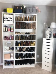 a white bookcase filled with lots of shoes next to a chest of drawers in a room