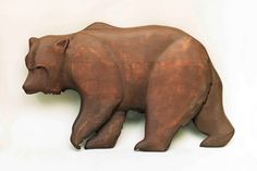 a sculpture of a bear is shown against a white background