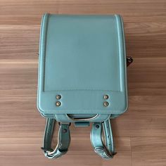 Randoseru : This randoseru made by Tsuchiya Bag company Which is one of the best randoseru maker in Japan. Its made by high quality Cowhide.  Item: Cowhide Leather school Bag / Japanese Randoseru - Light blue & White No.rnd012 Condition: Used/ Good. Please check the listing pictures. Size: Adult Wearable You could put your laptop without any ploblem. Tsuchiya Bag Company / Made in Japan Tsuchiya bag is one of the best randoseru maker in Japan. https://fujiyamarock.etsy.com Shipping Japan Post ta Large Capacity Leather Satchel Backpack For School, School Leather Satchel Backpack With Large Capacity, Practical School Satchel Shoulder Bag, Practical Satchel Shoulder Bag For School, Green School Satchel, Practical Shoulder Bag Backpack For School, Student Leather Satchel Backpack For Back To School, Back To School Leather Satchel Backpack, Back To School Satchel Leather Backpack