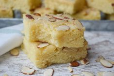 some food that is sitting on top of a paper towel with almonds around it