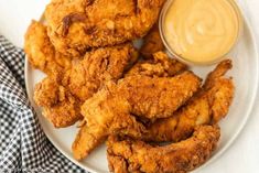 fried chicken on a plate with dipping sauce