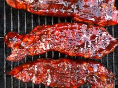 bbq ribs cooking on the grill with ketchup