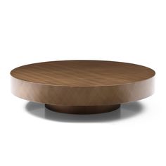 a round wooden table sitting on top of a white floor