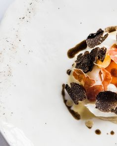 a white plate topped with food on top of a table