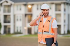 Builder using phone. Portrait of builder man. Construction worker with hardhat helmet on construction site. Construction stock photo Using Phone, Construction Work, Construction Management, Photo Site, Construction Worker, New Home Construction, Construction Site, Hard Hats, Vector Icons