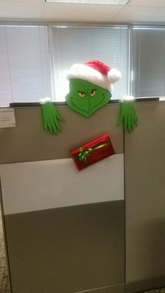 an office cubicle decorated to look like the grin