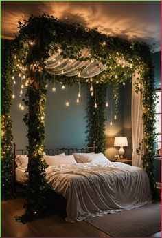 a bed covered in greenery with lights on the headboard and canopy over it