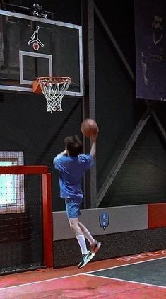 a man jumping up to dunk a basketball