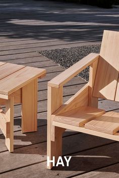 two wooden benches sitting next to each other