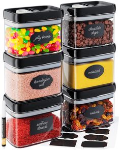 the four containers are filled with different types of candies