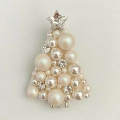 a white christmas tree made out of pearls