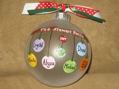 a christmas ornament with the names of different families on it