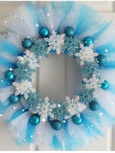 a blue and white wreath with snowflakes on it