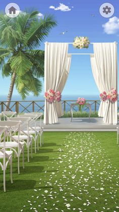 an outdoor ceremony setup with white chairs and flowers on the aisle, overlooking the ocean