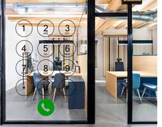 an office with glass doors and numbers on it