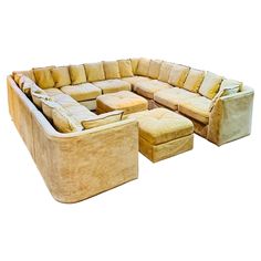 a large sectional couch and ottoman with matching footstools is shown in front of a white background