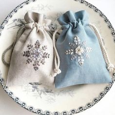 two small bags are sitting on a plate