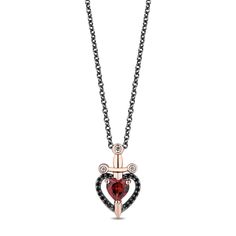 From the Enchanted Disney Fine Jewelry Villains Collection, this heart pendant necklace is inspired by the Evil Queen in 'Snow White and the Seven Dwarfs'. Crafted in black rhodium-plated sterling silver with 10k rose gold-plated accents, this pendant is reminiscent of the lock on the Evil Queen's frightening heart box and features the silhouette of a dagger top that seems to pierce a heart design. This heart is accented with treated black diamonds and a deeply hued garnet gemstone for an alluri Disney Evil Queen, Enchanted Disney, The Evil Queen, Enchanted Disney Fine Jewelry, Disney Fine Jewelry, Queen Jewelry, Wedding Day Jewelry, Heart Box, Metal Shop