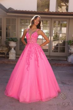 Nox Anabel H1357 Long Formal Prom Ball Gown is a timeless beauty. With delicate spaghetti straps and flowing tulle, this gown exudes elegance, perfect for your formal event. Fabric: Tulle Length: Full Length Sleeve Style: Spaghetti Strap Color: Bahama Blue, Hot Pink Sizes: 2, 4, 6, 8, 10, 12, 14, 16 Occasion: Formal Dresses, Prom Dresses Designer: Nox Anabel Style: NXH1357 Different Styles Of Prom Dresses, Big Formal Dresses, Grad Dresses Ball Gowns, Beautiful Long Dress, Big Prom Dresses Ball Gowns Pink, Fancy Dresses For Prom, Hot Pink Prom Dress Short, Hot Pink Corset Prom Dress, Flowing Prom Dress