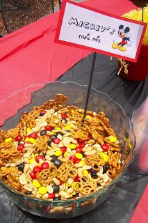 a mickey mouse pasta dish is on display at an outdoor event for children to eat