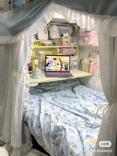 a bedroom with a bed, desk and shelves on the wall next to each other