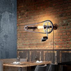 an industrial style dining room with exposed brick walls