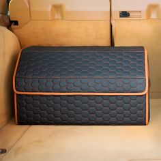 an upholstered seat cushion in the back of a car