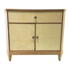 a white and beige cabinet with two doors