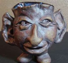 a ceramic head that is sitting on a table