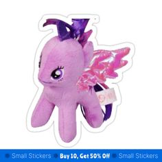 a pink pony with wings on it's head and purple hair is standing in front of a white background