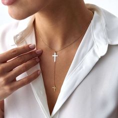 Elevate your style with our stunning cross lariat necklace, crafted from 14k solid gold. This elegant piece features a minimalist design with a symbolic double cross, embodying both grace and meaning. Perfect for layering or as a standout piece. Our necklace is crafted with real 14k solid gold (not plated, not vermeil, not gold filled) You don't need to worry about water, perfume or conditioner contact since real gold keeps its beauty for a lifetime. Drop length: 1. 25 Inches / 32. 0 mm Elegant Crucifix Cross Necklace, Elegant Cross Necklace With Adjustable Chain, Cross Lariat Necklace Gift, Elegant Cross Lariat Necklace, Elegant Cross Pendant Lariat Necklace With Adjustable Chain, Elegant Cross Lariat Necklace As A Gift, Elegant Cross Lariat Necklace Gift, Adjustable Cross Lariat Necklace, Elegant Cross Lariat Necklace For Gift