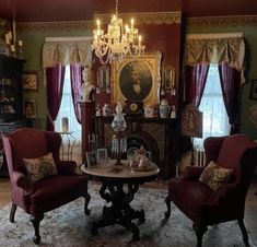 a living room filled with furniture and a chandelier