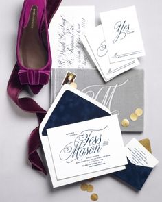 the wedding stationery is laid out and ready to be put into the bride's shoes