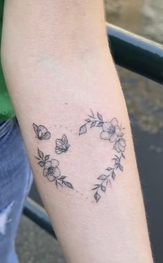 a person with a flower tattoo on their arm