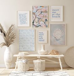 a white table topped with lots of pictures and vases