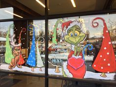 the grinch christmas window is decorated with holiday decorations